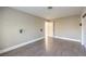 Simple bedroom with wood floors and door to hallway at 7755 Coley Ave, Las Vegas, NV 89117