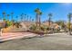 Single-story house with palm trees and a large driveway at 7755 Coley Ave, Las Vegas, NV 89117