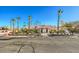 House exterior with palm trees and a three-car garage at 7755 Coley Ave, Las Vegas, NV 89117