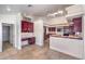 Kitchen features dark wood cabinets and an island at 7755 Coley Ave, Las Vegas, NV 89117