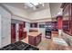 Modern kitchen with island, granite countertops, and stainless steel appliances at 7755 Coley Ave, Las Vegas, NV 89117
