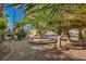 Landscaped yard with gravel and a unique fountain feature at 7755 Coley Ave, Las Vegas, NV 89117