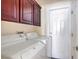 Laundry room with washer, dryer and cabinets at 7755 Coley Ave, Las Vegas, NV 89117