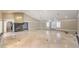 Open living room with tile floors and a fireplace at 7755 Coley Ave, Las Vegas, NV 89117
