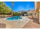 Inviting kidney shaped pool with ample patio space for lounging at 7755 Coley Ave, Las Vegas, NV 89117