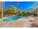 Inviting kidney-shaped pool with large patio at 7755 Coley Ave, Las Vegas, NV 89117