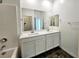 Bathroom featuring a dual sink vanity with a large mirror and tile flooring at 846 Star Estates Ave, North Las Vegas, NV 89086