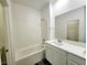 Bathroom featuring a bathtub with white subway tile and a dual sink vanity at 846 Star Estates Ave, North Las Vegas, NV 89086
