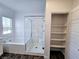 Bathroom with soaking tub, glass shower, and linen closet at 846 Star Estates Ave, North Las Vegas, NV 89086