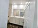 Bathroom featuring a dual sink vanity with a large mirror and tile flooring at 846 Star Estates Ave, North Las Vegas, NV 89086