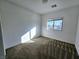 Bright bedroom featuring neutral carpet and a window providing natural light at 846 Star Estates Ave, North Las Vegas, NV 89086