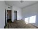 This bedroom features neutral carpet and closet space with paneled doors at 846 Star Estates Ave, North Las Vegas, NV 89086