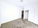 Bright bedroom featuring neutral carpet and a closet with paneled doors at 846 Star Estates Ave, North Las Vegas, NV 89086