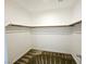 Walk-in closet with built-in shelves and carpet at 846 Star Estates Ave, North Las Vegas, NV 89086