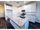 Beautiful kitchen with granite countertops, stainless steel appliances, and an island with a sink at 846 Star Estates Ave, North Las Vegas, NV 89086