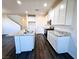 Bright kitchen with granite countertops, stainless steel appliances, white cabinets, and wood flooring at 846 Star Estates Ave, North Las Vegas, NV 89086