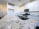 Bright kitchen features granite countertops, stainless steel appliances, and white cabinetry at 846 Star Estates Ave, North Las Vegas, NV 89086