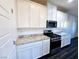 Kitchen with granite countertops, stainless steel appliances, and white cabinetry at 846 Star Estates Ave, North Las Vegas, NV 89086
