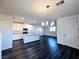Open concept kitchen and living area with wood floors at 846 Star Estates Ave, North Las Vegas, NV 89086