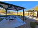 A relaxing picnic area with covered tables and lush greenery, perfect for outdoor gatherings at 846 Star Estates Ave, North Las Vegas, NV 89086