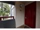 Exterior entryway with red door and balcony at 8600 W Charleston Blvd # 2101, Las Vegas, NV 89117