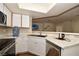 Kitchen features white cabinets, stainless steel appliances, and corner sink at 8600 W Charleston Blvd # 2101, Las Vegas, NV 89117