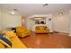 Open living room features hardwood floors and kitchen bar at 8600 W Charleston Blvd # 2101, Las Vegas, NV 89117