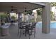 Community pool area with tables and chairs at 8600 W Charleston Blvd # 2101, Las Vegas, NV 89117