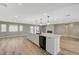 Modern kitchen with island and fireplace at 909 Rhyolite Ter, Henderson, NV 89011