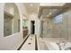 Elegant bathroom with a large walk-in shower and soaking tub at 9513 Verlaine Ct, Las Vegas, NV 89145