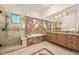 Luxurious bathroom with marble finishes, soaking tub, and walk-in shower at 9513 Verlaine Ct, Las Vegas, NV 89145