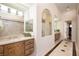 Bathroom with and sinks and a large mirror at 9513 Verlaine Ct, Las Vegas, NV 89145