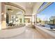 Breakfast nook with curved window offering pool and landscape views at 9513 Verlaine Ct, Las Vegas, NV 89145