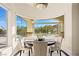 Bright dining area with a curved window showcasing scenic views at 9513 Verlaine Ct, Las Vegas, NV 89145