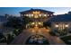 Elegant two-story home with a fountain and well-manicured landscaping at 9513 Verlaine Ct, Las Vegas, NV 89145