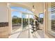 Home gym with sliding doors opening to the pool area at 9513 Verlaine Ct, Las Vegas, NV 89145