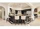Gourmet kitchen with dark cabinetry, granite counters, and stainless steel appliances at 9513 Verlaine Ct, Las Vegas, NV 89145