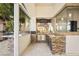 Outdoor kitchen with stone countertops and stainless steel appliances at 9513 Verlaine Ct, Las Vegas, NV 89145