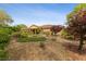 Landscaped backyard with artificial turf and patio at 10372 Hawks Wing St, Las Vegas, NV 89178