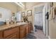 Bathroom with granite countertop, double sinks and shower/tub combo at 10372 Hawks Wing St, Las Vegas, NV 89178