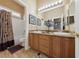 Double vanity bathroom with granite countertop at 10372 Hawks Wing St, Las Vegas, NV 89178