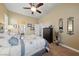 Comfortable bedroom with dresser and ceiling fan at 10372 Hawks Wing St, Las Vegas, NV 89178