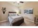 Bedroom with a queen bed and ceiling fan at 10372 Hawks Wing St, Las Vegas, NV 89178