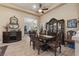Well-lit dining area featuring a formal dining set and hardwood floors at 10372 Hawks Wing St, Las Vegas, NV 89178