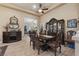 Well-lit dining area with a large hutch and seating for six at 10372 Hawks Wing St, Las Vegas, NV 89178