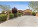 Single-story house with landscaped front yard, driveway, and attached garage at 10372 Hawks Wing St, Las Vegas, NV 89178