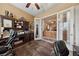 Home office with built-in shelving and wood desk at 10372 Hawks Wing St, Las Vegas, NV 89178