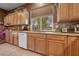 Well-equipped kitchen with wood cabinets and granite counters at 10372 Hawks Wing St, Las Vegas, NV 89178