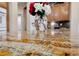 Kitchen island with granite countertop and flower vase at 10372 Hawks Wing St, Las Vegas, NV 89178