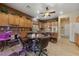 Eat-in kitchen with wood cabinets and tile floors at 10372 Hawks Wing St, Las Vegas, NV 89178